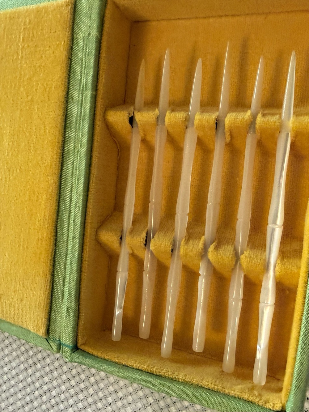 Mother-of-pearl carved toothpicks in velvet case